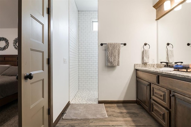 13 Ivory Dr, Yukon, OK 73099 - bathroom featuring walk in shower, vanity, ensuite bathroom, and wood finished floors