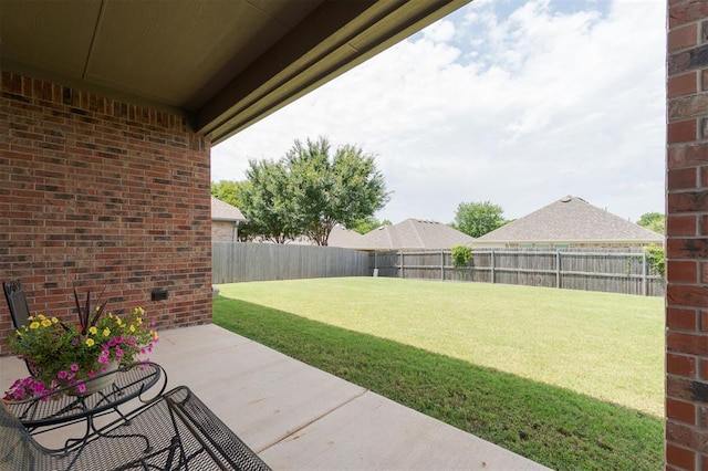 13 Ivory Dr, Yukon, OK 73099 - fenced backyard featuring a patio