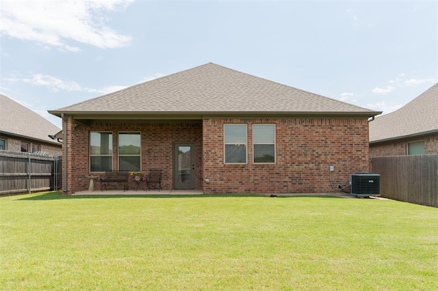 13 Ivory Dr, Yukon, OK 73099 - rear view of house with a fenced backyard and brick siding