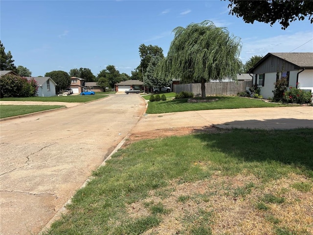 5612 NW 65th St, Warr Acres, OK 73132 - view of concrete road featuring curbs