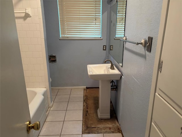 5612 NW 65th St, Warr Acres, OK 73132 - bathroom featuring tile patterned floors and shower / bathtub combination