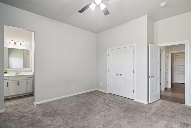 12825 SW 26th St, Yukon, OK 73099 - unfurnished bedroom featuring carpet floors, connected bathroom, and ceiling fan