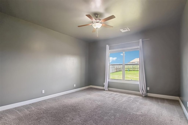 12825 SW 26th St, Yukon, OK 73099 - spare room with a ceiling fan and carpet