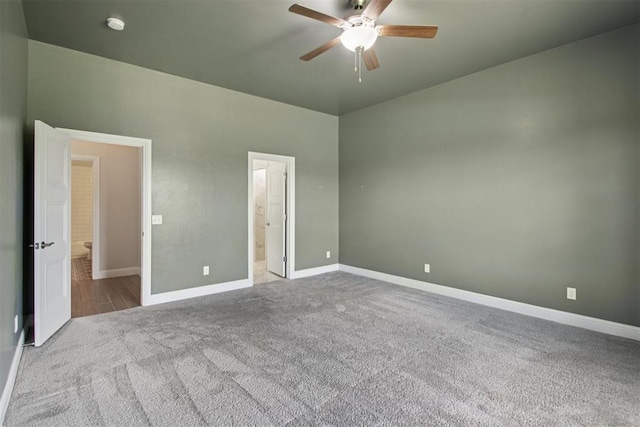 12825 SW 26th St, Yukon, OK 73099 - unfurnished bedroom with carpet floors, connected bathroom, and ceiling fan