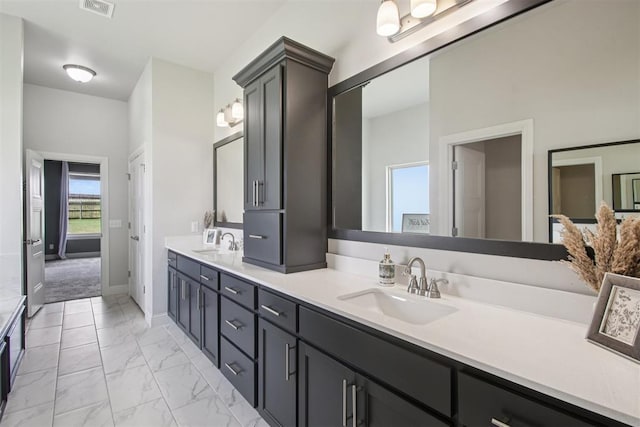 12825 SW 26th St, Yukon, OK 73099 - full bath with double vanity and marble look tiles