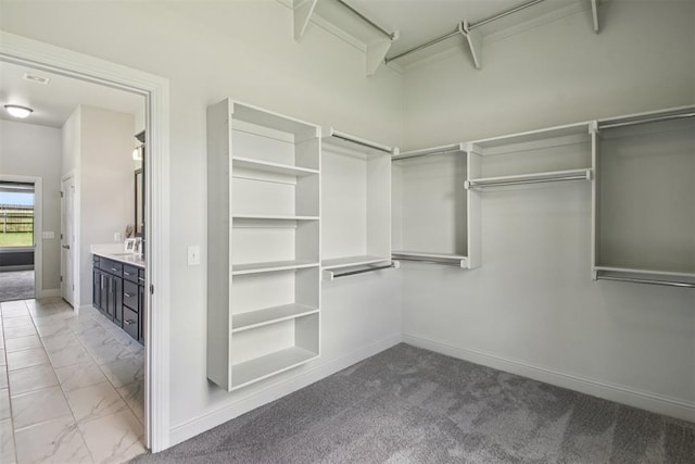 12825 SW 26th St, Yukon, OK 73099 - walk in closet featuring marble finish floors