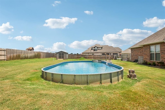 12825 SW 26th St, Yukon, OK 73099 - view of pool featuring a storage shed and a fenced backyard