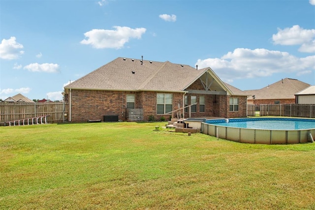 12825 SW 26th St, Yukon, OK 73099 - back of property with brick siding and a shingled roof