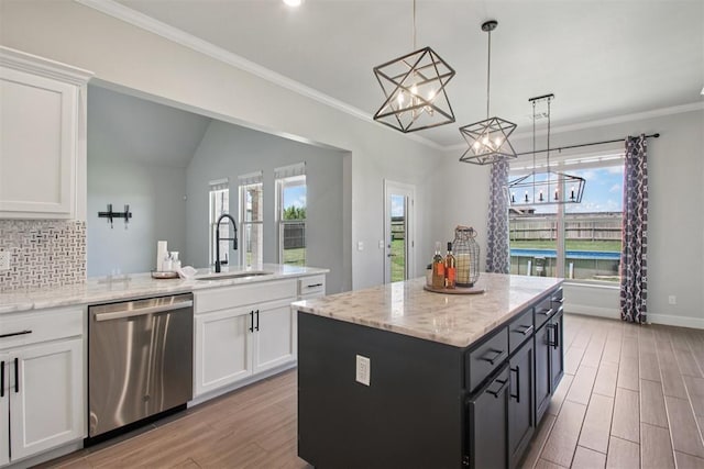12825 SW 26th St, Yukon, OK 73099 - kitchen with stainless steel dishwasher, light wood-style flooring, a chandelier, tasteful backsplash, and white cabinetry