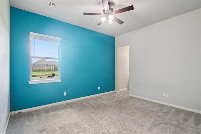 12825 SW 26th St, Yukon, OK 73099 - carpeted empty room with a ceiling fan and baseboards