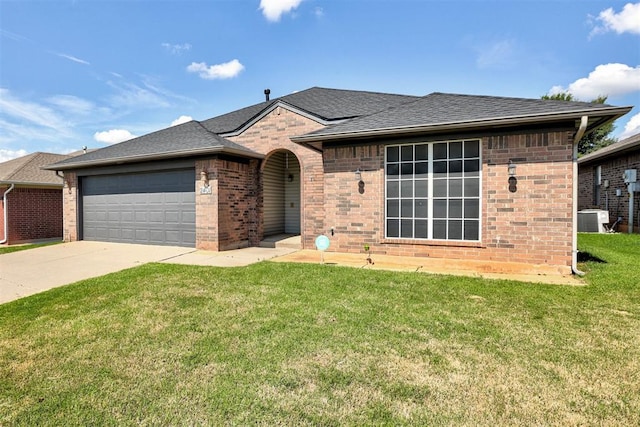 2401 Westchester Dr, Moore, OK 73160 - single story home featuring brick siding, a shingled roof, an attached garage, driveway, and a front lawn