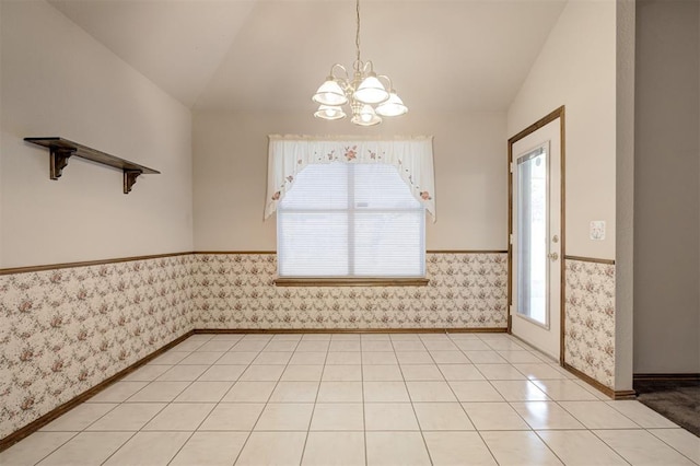 2401 Westchester Dr, Moore, OK 73160 - empty room featuring vaulted ceiling, a chandelier, and wallpapered walls