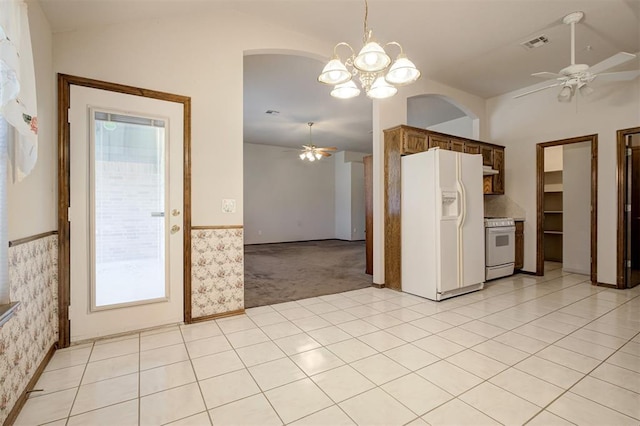 2401 Westchester Dr, Moore, OK 73160 - kitchen featuring a ceiling fan, white appliances, lofted ceiling, a chandelier, and arched walkways