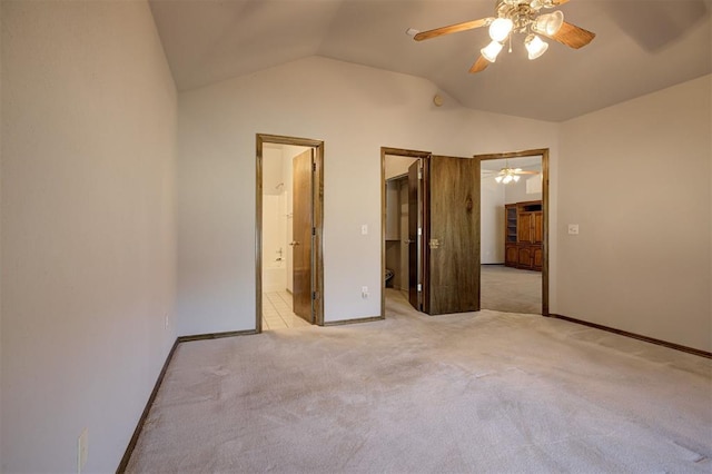 2401 Westchester Dr, Moore, OK 73160 - unfurnished bedroom with lofted ceiling, a walk in closet, carpet floors, ensuite bathroom, and ceiling fan