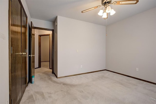 2401 Westchester Dr, Moore, OK 73160 - unfurnished bedroom with light colored carpet and ceiling fan