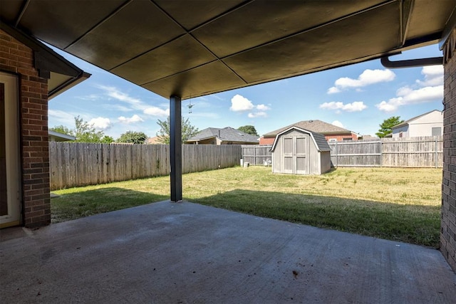 2401 Westchester Dr, Moore, OK 73160 - fenced backyard featuring a patio area and a storage shed