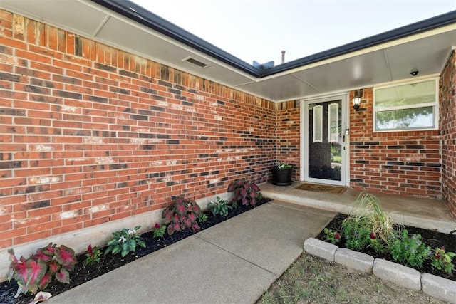 815 W 7th St, Edmond, OK 73003 - entrance to property featuring brick siding