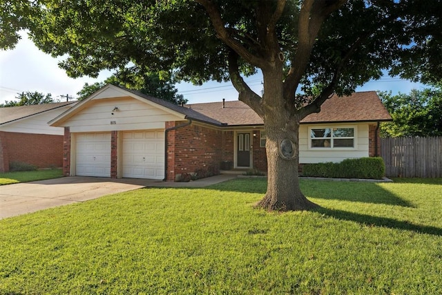 815 W 7th St, Edmond, OK 73003 - single story home featuring brick siding, an attached garage, and driveway