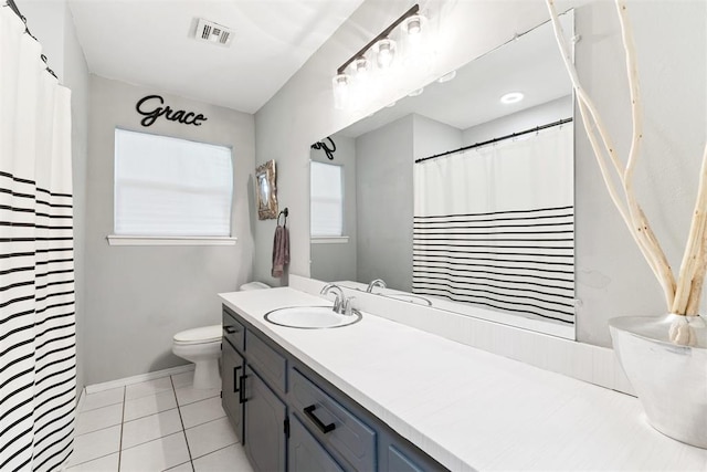 815 W 7th St, Edmond, OK 73003 - bathroom with vanity, tile patterned floors, and a shower with curtain