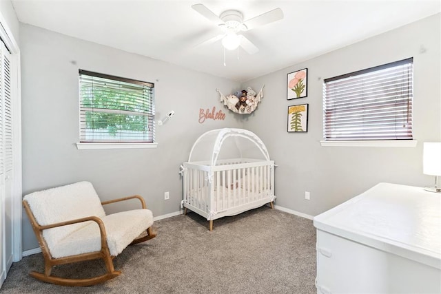 815 W 7th St, Edmond, OK 73003 - bedroom featuring a closet, light colored carpet, a nursery area, and ceiling fan