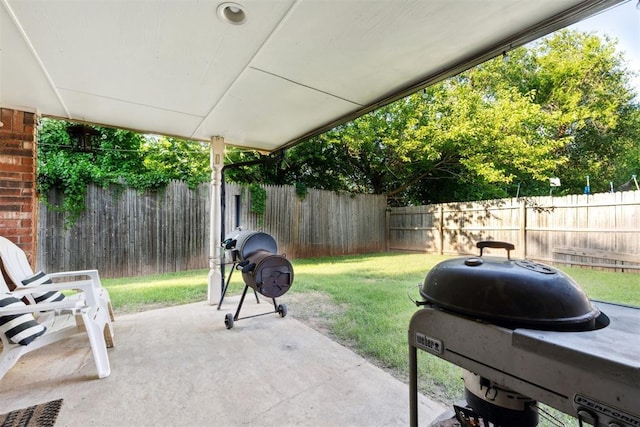 815 W 7th St, Edmond, OK 73003 - fenced backyard featuring area for grilling and a patio area