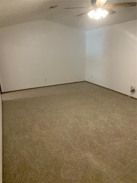 515 Cripple Creek Dr, Norman, OK 73071 - carpeted spare room featuring a ceiling fan and lofted ceiling