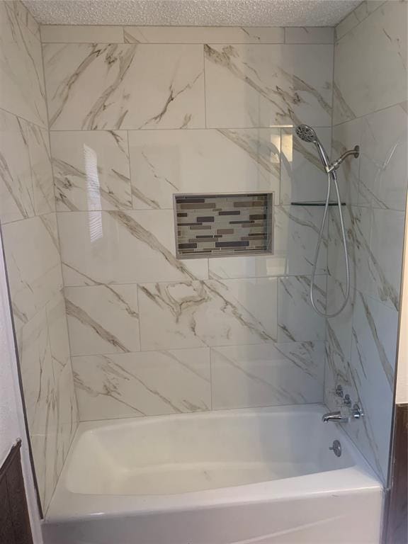 515 Cripple Creek Dr, Norman, OK 73071 - bathroom with a textured ceiling and bathtub / shower combination