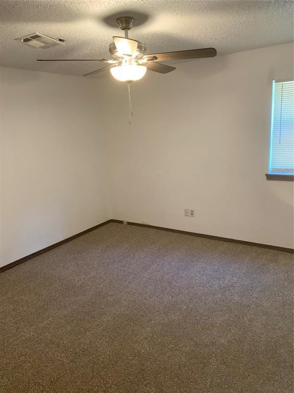 515 Cripple Creek Dr, Norman, OK 73071 - empty room with ceiling fan, a textured ceiling, and carpet floors