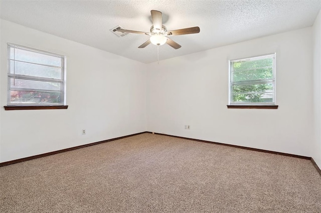 515 Cripple Creek Dr, Norman, OK 73071 - carpeted spare room with a ceiling fan and a textured ceiling