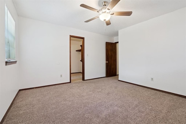 515 Cripple Creek Dr, Norman, OK 73071 - empty room featuring light colored carpet and a ceiling fan