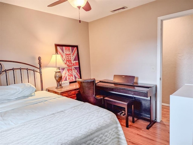 2901 Maple Ln, Edmond, OK 73034 - bedroom with light wood finished floors and ceiling fan