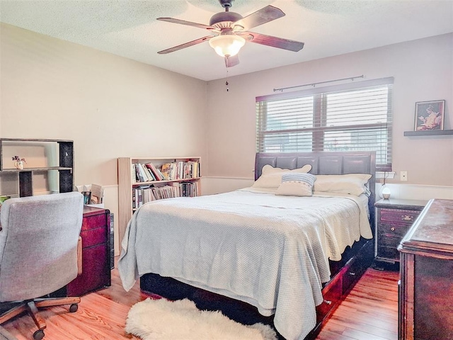 2901 Maple Ln, Edmond, OK 73034 - bedroom with wood finished floors and ceiling fan