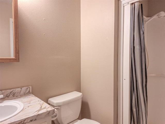 2901 Maple Ln, Edmond, OK 73034 - bathroom featuring vanity and toilet
