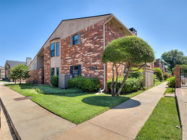 6500 N Grand Blvd Unit 131, Oklahoma City, OK 73116 - view of home's exterior with brick siding