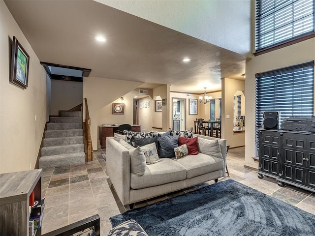 6500 N Grand Blvd Unit 131, Oklahoma City, OK 73116 - living area with a chandelier, stone tile flooring, stairway, healthy amount of natural light, and recessed lighting