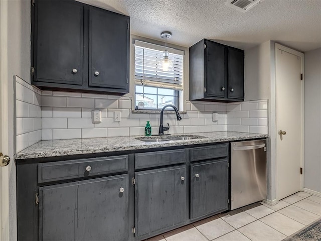 6500 N Grand Blvd Unit 131, Oklahoma City, OK 73116 - kitchen featuring dishwasher, a textured ceiling, backsplash, light tile patterned flooring, and light stone counters