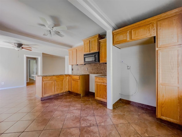 2437 NW 36th Ter, Oklahoma City, OK 73112 - kitchen featuring black microwave, backsplash, a ceiling fan, light countertops, and light tile patterned flooring