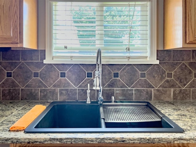 2437 NW 36th Ter, Oklahoma City, OK 73112 - kitchen view of a sink and backsplash