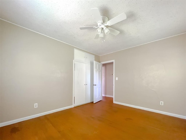 2437 NW 36th Ter, Oklahoma City, OK 73112 - empty room with ceiling fan and a textured ceiling