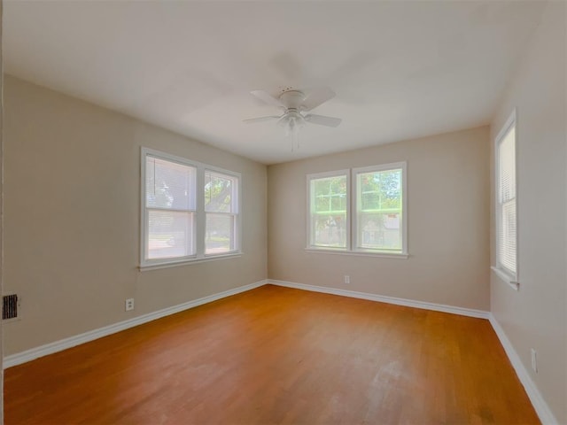 2437 NW 36th Ter, Oklahoma City, OK 73112 - unfurnished room featuring light wood-style flooring and a ceiling fan