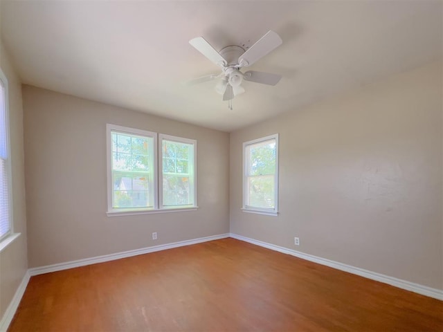 2437 NW 36th Ter, Oklahoma City, OK 73112 - unfurnished room with wood finished floors and a ceiling fan
