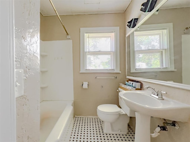 2437 NW 36th Ter, Oklahoma City, OK 73112 - bathroom featuring bathtub / shower combination and tile patterned floors