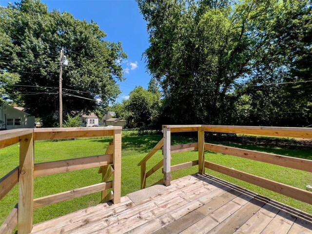 2437 NW 36th Ter, Oklahoma City, OK 73112 - wooden deck with a yard
