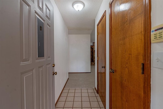 3116 SW 96th St, Oklahoma City, OK 73159 - corridor with a textured ceiling, light colored carpet, and light tile patterned floors