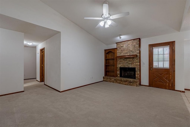 3116 SW 96th St, Oklahoma City, OK 73159 - unfurnished living room featuring lofted ceiling, light carpet, a fireplace, and a ceiling fan