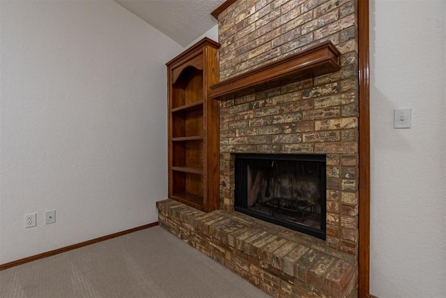 3116 SW 96th St, Oklahoma City, OK 73159 - unfurnished living room with carpet, a fireplace, a textured ceiling, and lofted ceiling