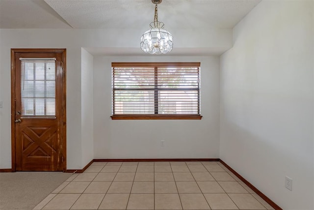 3116 SW 96th St, Oklahoma City, OK 73159 - spare room featuring plenty of natural light and a chandelier