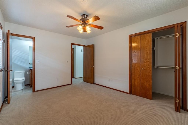 3116 SW 96th St, Oklahoma City, OK 73159 - unfurnished bedroom featuring a closet, light colored carpet, ceiling fan, and ensuite bathroom