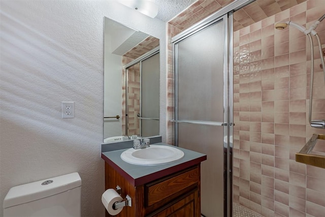 3116 SW 96th St, Oklahoma City, OK 73159 - bathroom with a stall shower, vanity, and a textured wall