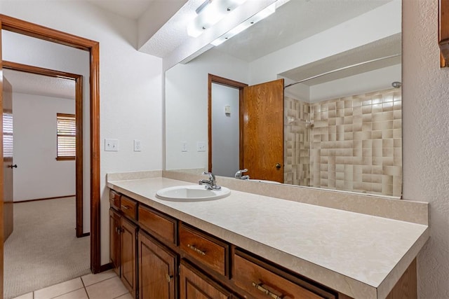 3116 SW 96th St, Oklahoma City, OK 73159 - bathroom with vanity, tile patterned floors, and a textured wall